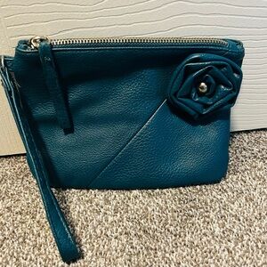 Turquoise wristlet with flower decal and zipper closure